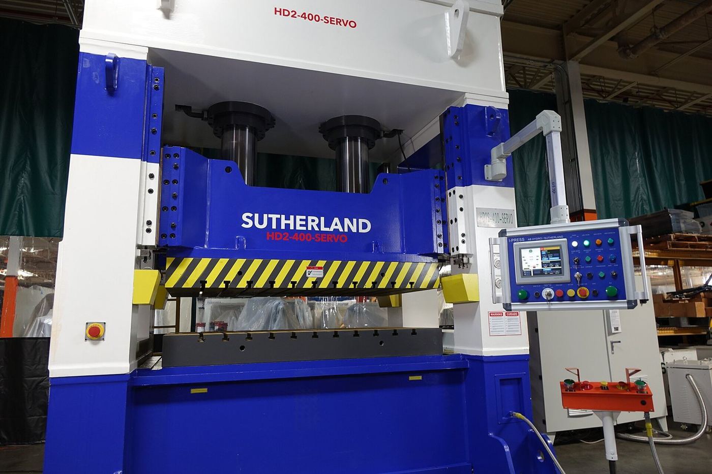 Servo-hydraulic compression-moulding press.