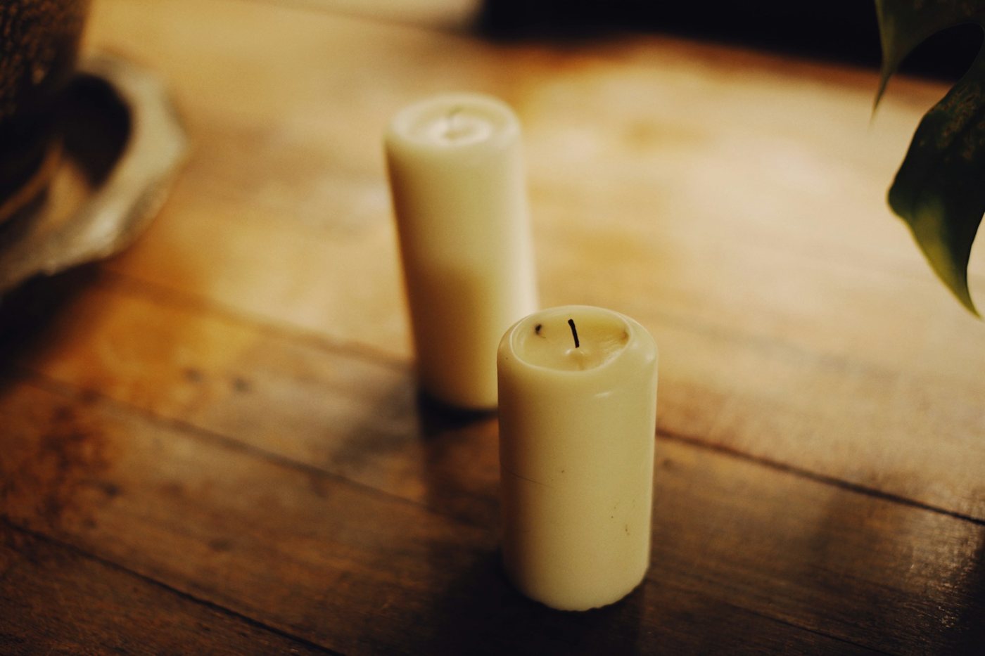 Pillar candles on a wooden table