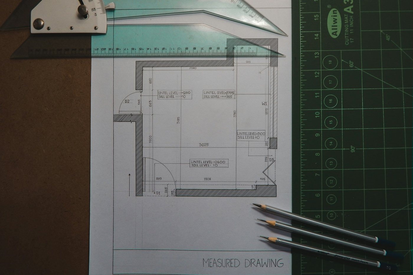 Technical drawing with pencils on a drafting board