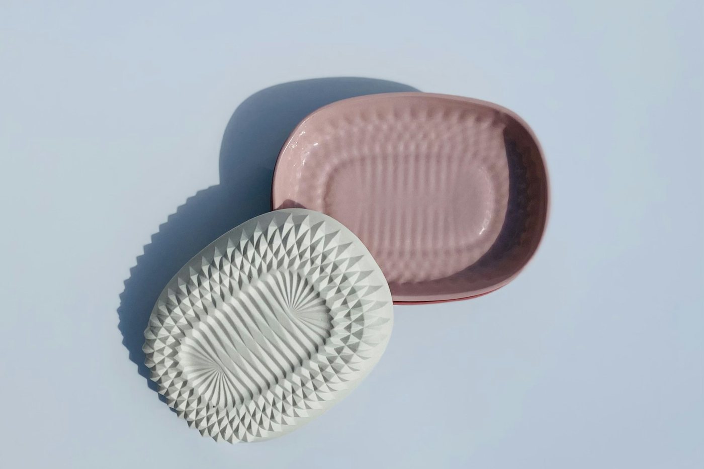 Moulded soap dishes in soft pastel colours