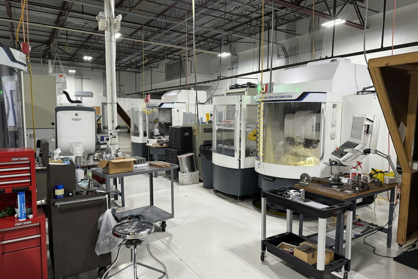 Clean machine shop with CNC machines and tooling